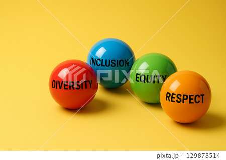A line of multicolored marbles on yellow background, symbolizing the strength of inclusion and equity through connected diversity A line of multicolored marbles on yellow background, symbolizing the strength of inclusion and equity through connected diversity 129878514