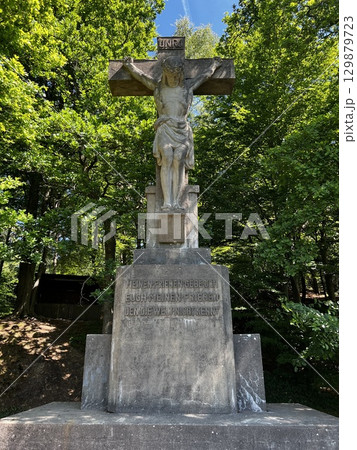 Stone cross with crucifix near the town of Riesenbeck, Germany 129879723