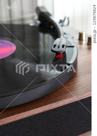 Close-up of a vintage-style turntable Close-up of a vintage-style turntable 129879824