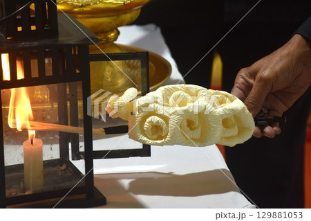 hand burning lantern sandalwood flower and robes for monks in Buddhiat funerel 129881053
