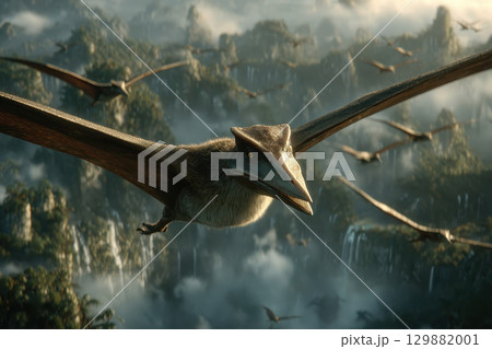 Close-up of pterosaurs soaring over misty prehistoric jungle with lush greenery and dramatic mountain landscape in the background 129882001