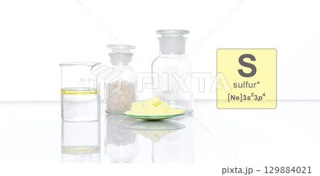 Sulfur Powder in Chemical Watch Glass with Symbol, Name and Electron Configuration on white laboratory table. Sulfur Powder in Chemical Watch Glass with Symbol, Name and Electron Configuration on white laboratory table. 129884021