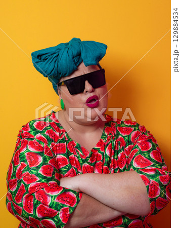 Cool plus size woman crossing arms with sunglasses Cool plus size woman crossing arms with sunglasses 129884534