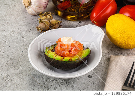Whole grilled avocado with salmon Whole grilled avocado with salmon 129886174