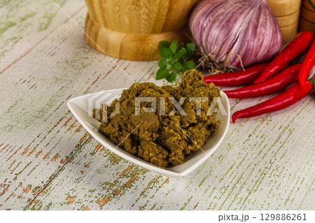 Yellow Thai spicy curry paste 129886261
