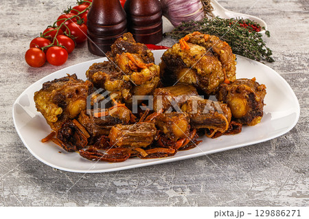 Baked oztail with tomato and carrot Baked oztail with tomato and carrot 129886271