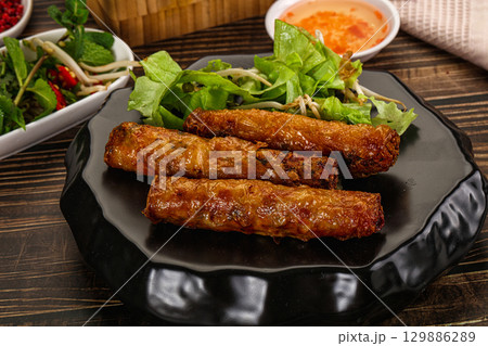 Fried Vietnamese spring roll with special sauce 129886289