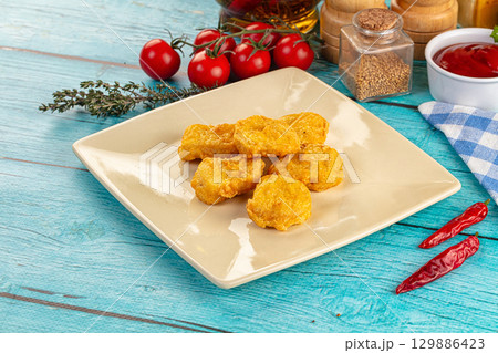 Golden crispy fried chicken nuggets Golden crispy fried chicken nuggets 129886423