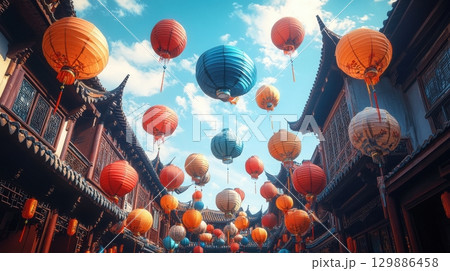A street with many colorful lanterns hanging from the roof 129886458
