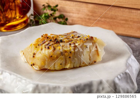 Steamed cod fish fillet with spices 129886565