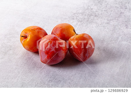 Ripe sweet juicy fresh purple plums Ripe sweet juicy fresh purple plums 129886929