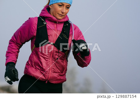 Trail Runner in Misty Mountain Landscape 129887154
