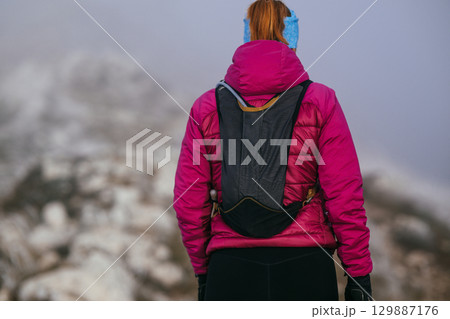 Trail Runner in Misty Mountain Landscape Trail Runner in Misty Mountain Landscape 129887176