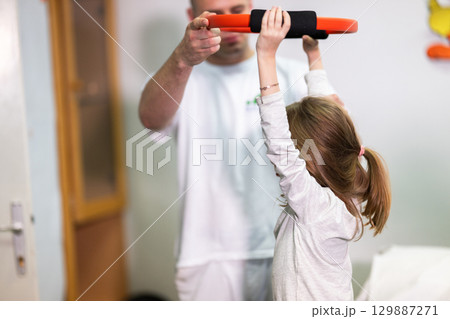 Child Doing Physical Therapy with Ring Child Doing Physical Therapy with Ring 129887271