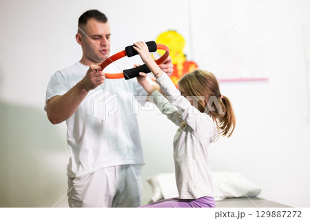 Child Doing Physical Therapy with Ring Child Doing Physical Therapy with Ring 129887272