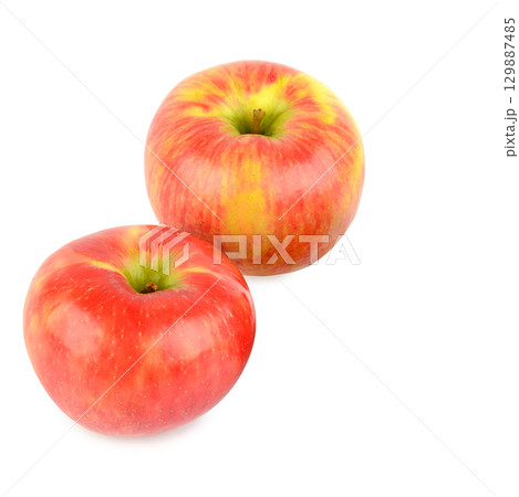 Two Red Apples Isolated on a White Background. 129887485