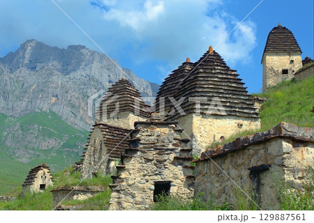 Dargavs, North Ossetia-Alania, Russia. City of the dead, ancient necropolis in the mountains of North Caucasus. Dargavs, North Ossetia-Alania, Russia. City of the dead, ancient necropolis in the mountains of North Caucasus. 129887561