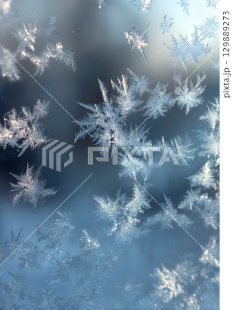 ice crystals forming on window glass 129889273