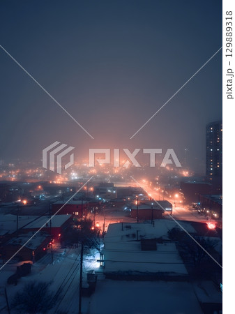 blurry snowstorm night with glowing city lights 129889318