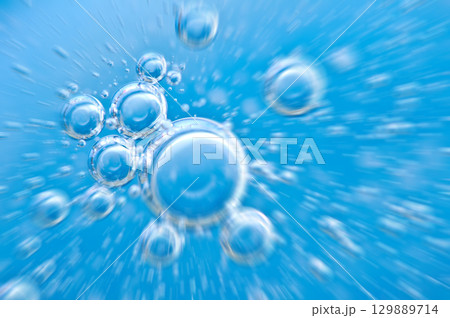 Water. Movement of air bubbles blue beautiful abstract underwater background 129889714