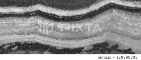 Agate surface background. Black and white transparent crystal background. Macro Agate surface background. Black and white transparent crystal background. Macro 129890808