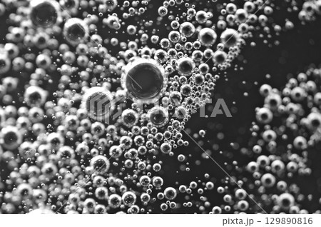Dark oil with bubbles in liquid. Black and white. Oil business concept and petrol production Dark oil with bubbles in liquid. Black and white. Oil business concept and petrol production 129890816