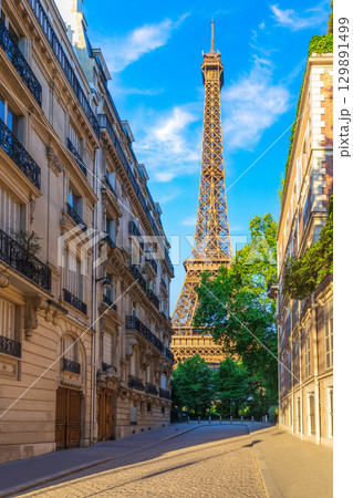Eiffel Tower, famous landmark of Paris, view from a typical street of France Eiffel Tower, famous landmark of Paris, view from a typical street of France 129891499