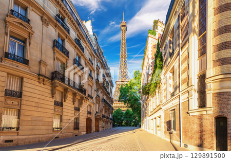 View on the Eiffel Tower from a typical street of France, famous landmark of Paris 129891500