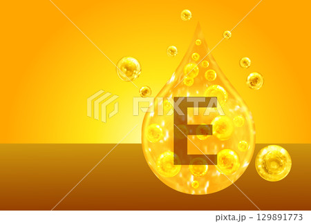 Vitamin E. Golden drops with oxygen bubbles. Health concept 129891773
