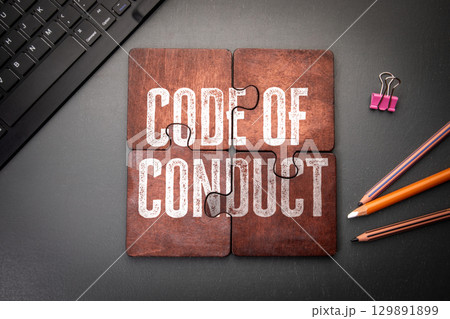 Code of Conduct Concept Shown on Puzzle Pieces in Office Workspace Setting 129891899