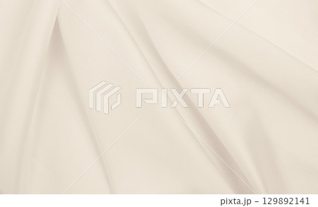 Smooth elegant golden silk or satin luxury cloth texture as wedding background. Luxurious background design. In Sepia toned. Retro style 129892141
