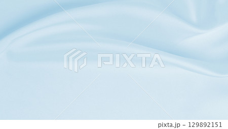 Smooth elegant blue silk or satin luxury cloth texture as abstract background. Luxurious background design 129892151