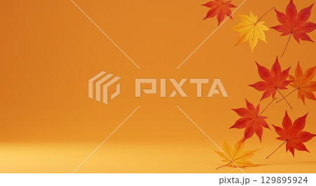 モミジの葉とオレンジの背景 モミジの葉とオレンジの背景 129895924
