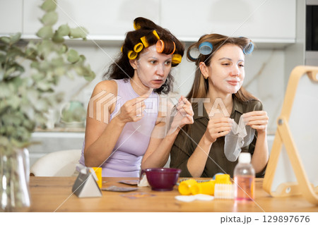 Adult and young women use face masks Adult and young women use face masks 129897676