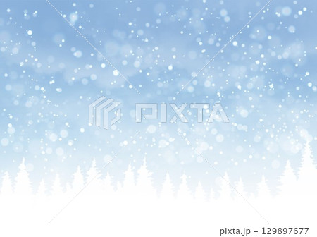 雪の夜空に浮かぶ木のシルエット 129897677