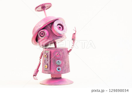 Wooden robot toy on isolated background 129898034