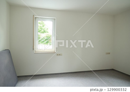 Bedroom with a window and a bed 129900332