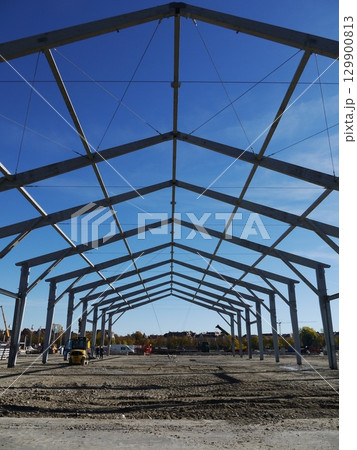Large building with a blue sky in the background 129900813