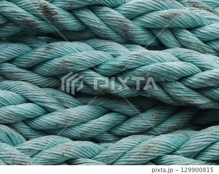 The rope is blue and has a lot of knots 129900815