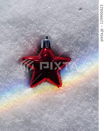Red star is on top of a white snow Red star is on top of a white snow 129900823