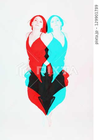 Happy woman with black clothes jumping to air Happy woman with black clothes jumping to air 129901789