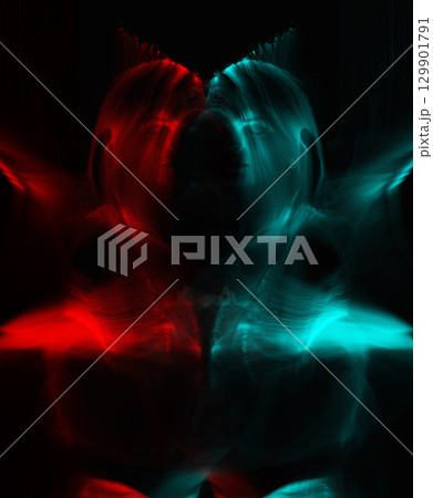 Light trails of light painting vivid color woman portrait 129901791