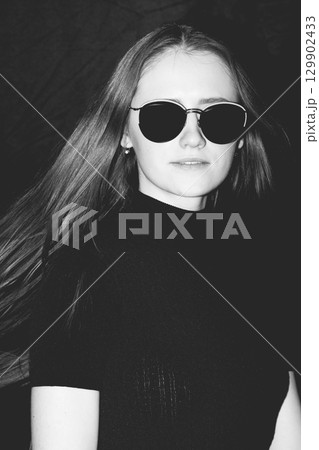 Brunette beautiful woman close-up portrait with sunglasses 129902433