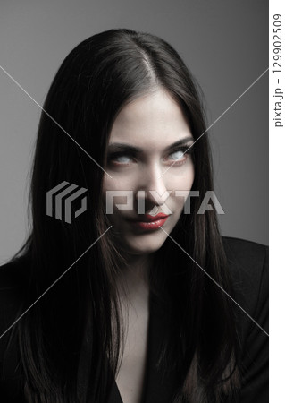 Beautiful woman with white eyes horror portrait 129902509