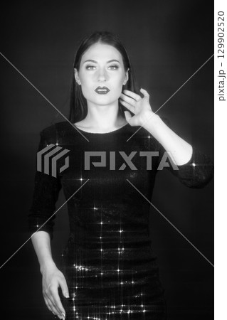 Fashion woman portrait with shining black dress 129902520
