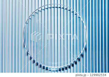 Empty petri dish on blue striped ribbed glass. Mockup for cosmetic product sample Empty petri dish on blue striped ribbed glass. Mockup for cosmetic product sample 129902534