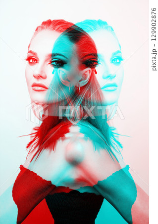 Beautiful woman with smokey makeup close up studio portrait in RGB color split effect 129902876