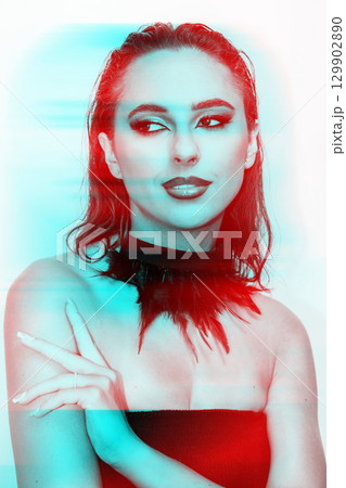 Beautiful woman with smokey make-up close-up studio portrait in RGB color split effect 129902890