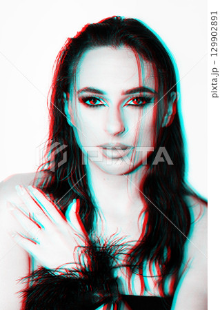 Beautiful woman with smokey makeup close up studio portrait in RGB color split effect 129902891