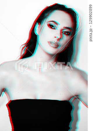 Beautiful woman with smokey make-up close up studio portrait in RGB color split effect 129902899